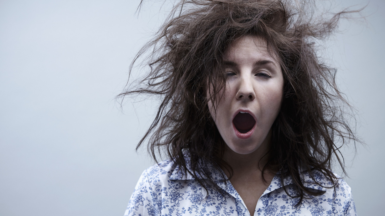 Young woman yawning, close up